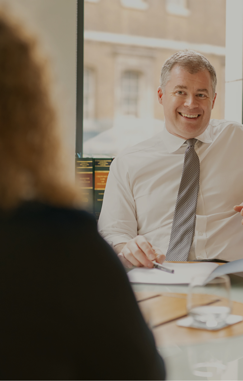 happy male indemnity professional in conversation